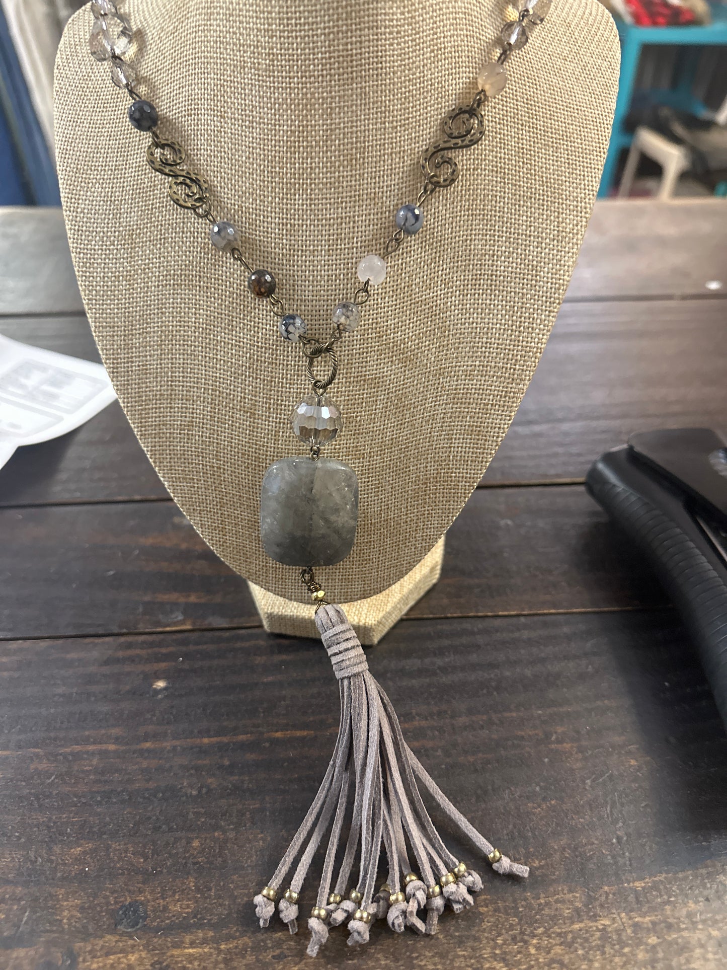 Grey stone tassel neck